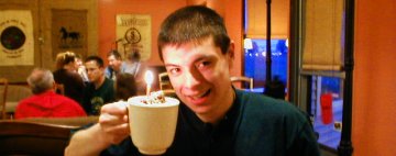 Nathan Matias Goes Drinking -- Hot Chocolate with a 21st birthday candle in the whipped cream